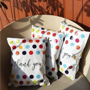 20 14” x 19”. White with primary color polka dots. “Thank You” printed in middle
